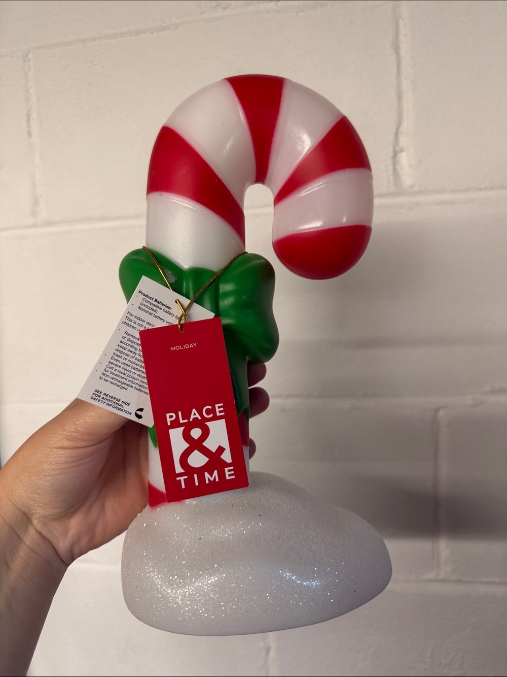 Red and White Candy Cane Ornament with Green Bow